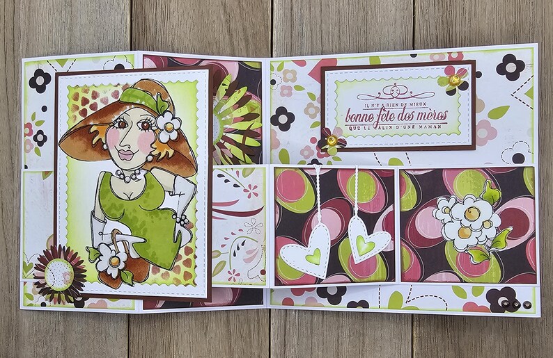 May include: A handmade Mother's Day card with a whimsical illustration of a woman in a hat and dress. The card features floral patterns in pink, green, and brown, with the French text "bonne f&ecirc;te des m&egrave;res".
