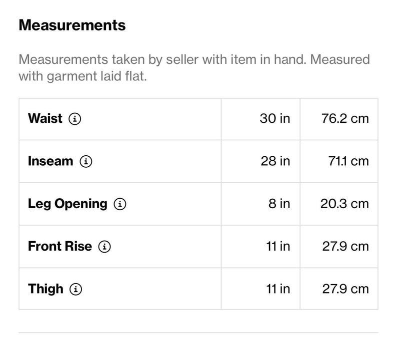 May include: A white table displays a chart of garment measurements. The waist is 30 inches (76.2 cm), inseam is 28 inches (71.1 cm), leg opening is 8 inches (20.3 cm), front rise and thigh are both 11 inches (27.9 cm).