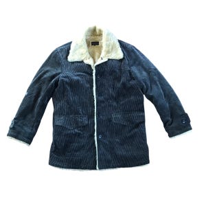 May include: A dark blue corduroy jacket with a faux fur collar and lining. The jacket has a button closure and two front pockets.