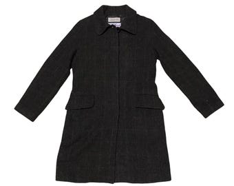 May include: A long-sleeved, dark gray wool coat with a classic collar and a button closure. The coat has two pockets on the front and a subtle striped pattern.