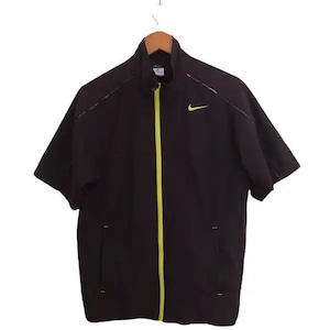 May include: Black short-sleeved jacket with a yellow zipper and a Nike logo on the left chest.
