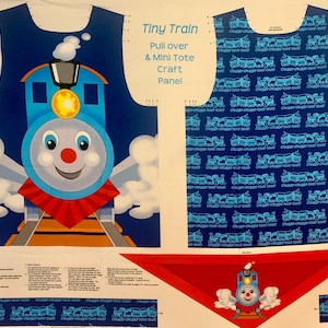 May include: A blue and white fabric panel featuring a cartoon train design. The panel includes a large train graphic with a smiling face, and the text "Tiny Train Pull over & Mini Tote Craft Panel". Additional fabric pieces with train patterns are also visible.