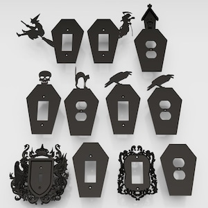 以下が含まれることがあります： ハロウィーンをテーマにしたデザインの黒い金属製ライトスイッチとコンセントカバーのコレクション。カバーには、ほうきに乗った魔女、骸骨、黒猫、カラス、お化け屋敷のシルエットが描かれています。カバーは棺の形をしています。
