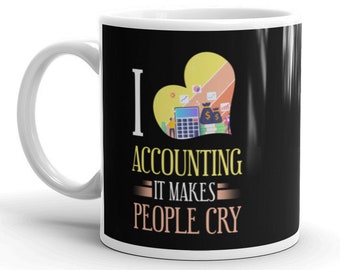 May include: White ceramic mug with a black background and the text "I LOVE ACCOUNTING IT MAKES PEOPLE CRY." The design includes a heart-shaped graphic with a calculator, money bags, and charts. The mug has a white handle.