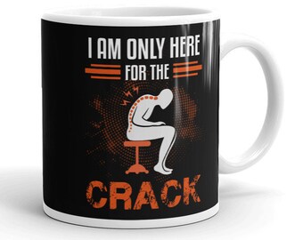 May include: A white ceramic mug with a black background and orange text that reads "I am only here for the crack". The mug features a cartoon illustration of a person with a backache sitting on a stool.
