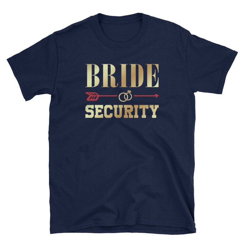 May include: Navy blue t-shirt with gold text that reads "Bride Security" and a red arrow with gold rings.
