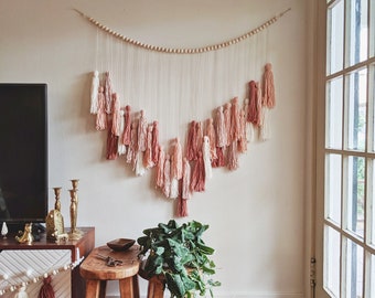 Warm blush pink and mauve yarn tassel wall hanging / Earth tone fiber art / Boho wall decor / Girls Nursery / Tassel garland