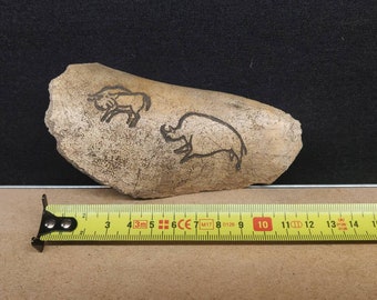 modern bone with paleolithic neolithic engraving reproduction