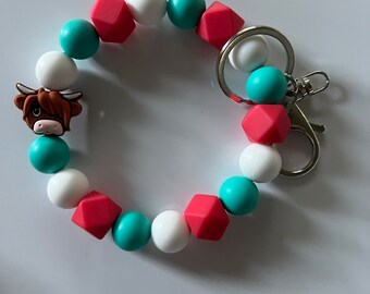 Set Di 2 Portachiavi Mucca Delle Highlands Con Nappa - Simpatico Bracciale In Silicone E Pelle
