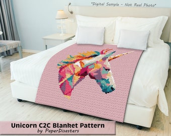 May include: A pink crochet blanket with a colorful unicorn design. The blanket is on a bed with white sheets and pillows. "Digital Sample - Not Real Photo" is written at the top of the image. "Unicorn C2C Blanket Pattern by PaperDisasters" is written at the bottom of the image.