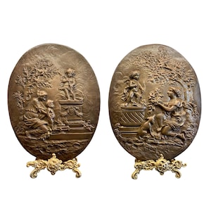 antique edwardian circa 1910 french louis style cast bronze metal wall plaques in relief depicting a garden scene with a lady child cherub