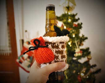 Santa Claus à travers la couverture de bouteille de vacances de crochet de cheminée, manche tricotée de tasse festive avec Santa, chauffe-thé de Noel de tricot de main pour la tasse