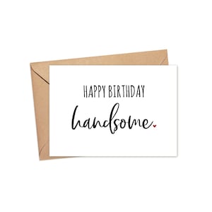 May include: A white greeting card with the text "HAPPY BIRTHDAY handsome" in black script and a small red heart. The card is paired with a brown envelope, perfect for sending birthday wishes.