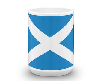 May include: White ceramic mug with a blue and white Scottish flag design.