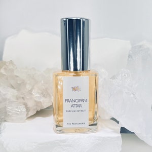 The Parfumerie offers Frangipani Attar 30 ml Parfum Extrait with Organic Cane Alcohol. A spray perfume bottle.