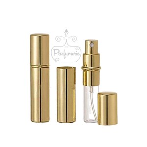Gold Metallic Perfume Bottle with it's full body gold on and also showing the cap and body off to see there is a clear 12 ml Roll on Bottle inside the gold casing. This allows you to see how much perfume is left.
