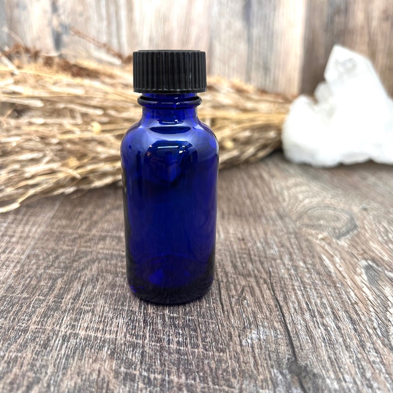 1 oz. Cobalt Blue Boston Round Bottle can hold Amber White, Jasmine, Egyptian Musk as well as Rose Perfumes.