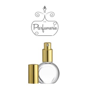 A clear, glass, rounded perfume bottle with a gold sprayer and flat front to accommodate a perfume label.