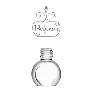 A clear glass travel perfume bottle.