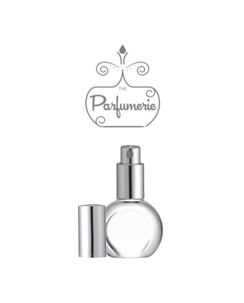 A clear, glass, rounded perfume bottle with a silver sprayer and flat front to accommodate a perfume label.