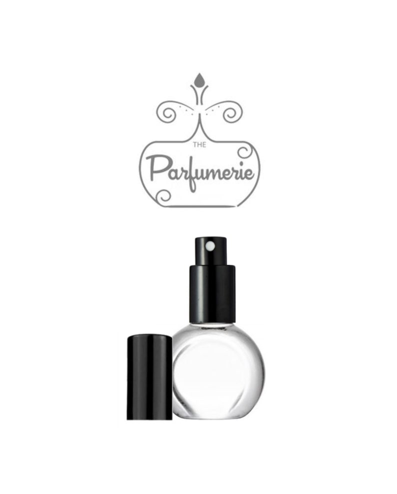 A clear, glass, rounded perfume bottle with a black sprayer and flat front to accommodate a perfume label.