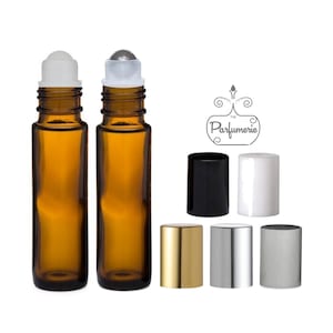 May include: Two amber glass roller bottles with white caps and silver roller balls. The bottles are 10 ml in size.  The image also shows six different colored caps: black, white, gold, silver, and gray.