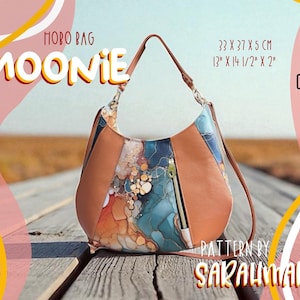 Könnte beinhalten: Braune und gemusterte Hobo-Tasche mit dem Text "MOONIE". Die Tasche misst 33 x 37 x 5 cm und hat eine Reißverschlusstasche. Das Design umfasst ein YouTube-Symbol und ein PDF-Symbol.