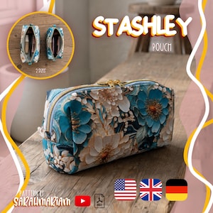 Könnte beinhalten: Ein rechteckiges Reißverschlussetui mit einem blütenartigen Muster in Blaugrün und Weiß sowie goldfarbenen Beschlägen. Der Text STASHLEY POUCH ist oben zu sehen. Ein kleiner Kreis zeigt zwei Etuis in verschiedenen Größen mit Kosmetikartikeln.