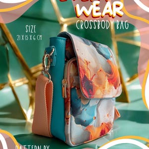 May include: A teal and peach crossbody bag with a colourful abstract design. The bag has a peach-coloured strap and gold hardware. The text "EVERY WEAR CROSSBODY BAG" is displayed. The bag measures 21 x 15 x 6 cm.