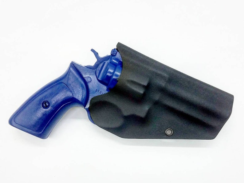 May include: A blue revolver handgun with a black leather holster. The gun has a black barrel and a blue grip. The holster has a single snap closure.