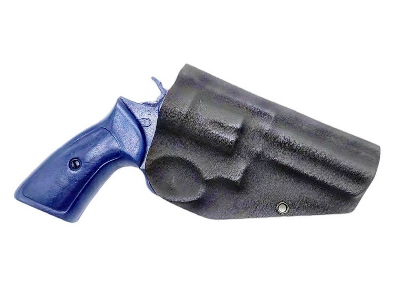 May include: A blue revolver with a black leather holster. The holster has a snap closure and a metal eyelet.
