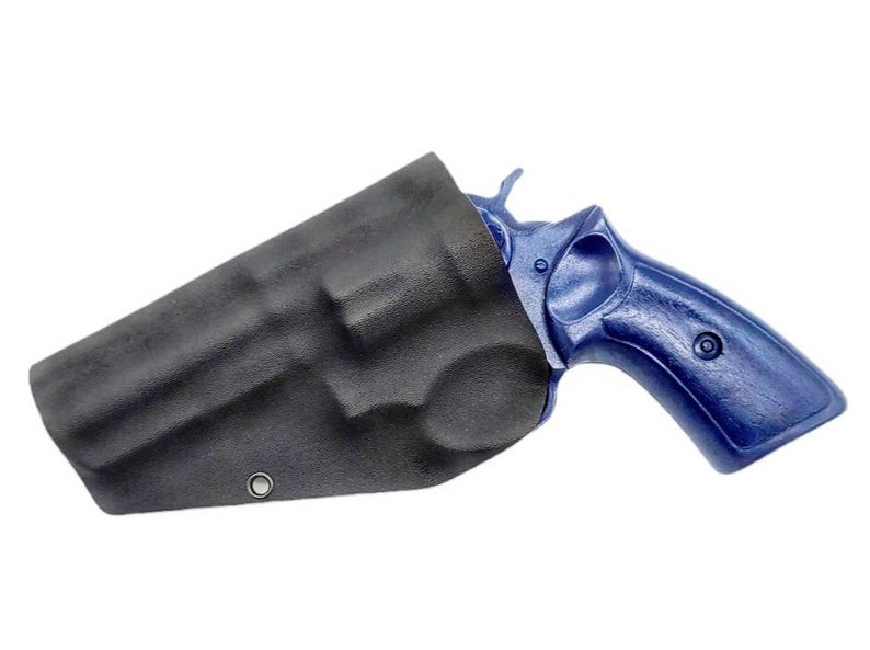 May include: A black leather holster with a blue revolver inside. The holster has a single metal eyelet.