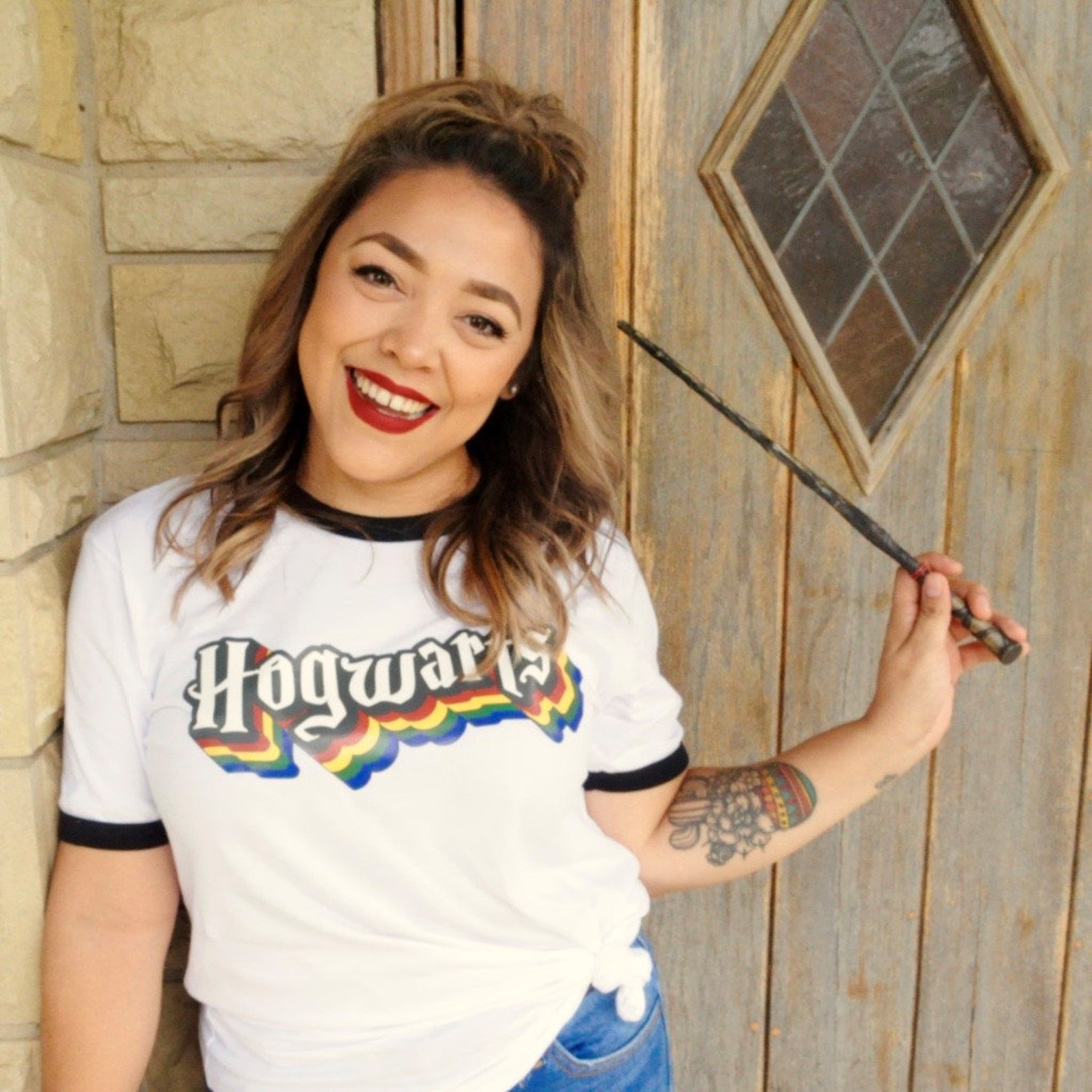 retro harry potter hogwarts tee on girl with wand.