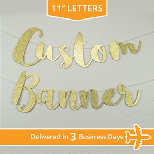 May include: Gold glitter custom banner with the words "Custom Banner" in cursive lettering. The banner is 11 inches tall and is strung on a white string.
