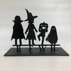 Family Trick or Treaters 473-003 Houten bord voor Halloween