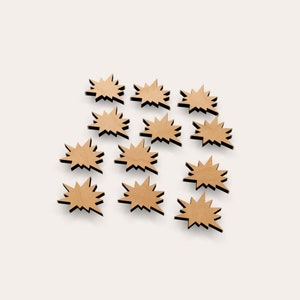 May include: A set of 12 brown cardboard starburst shapes with black outlines. The starbursts are arranged in a loose circle pattern.