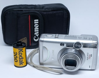 CANON– Sure Shot 150u/ Autoboy N150/ Prima Super 150u– 35mm film Point & Shoot Camera- Film tested Fully Functional– Case Strap Film Battery
