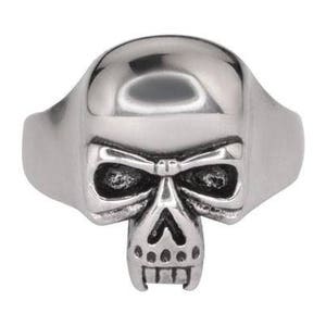 May include: A silver skull ring with a detailed design. The skull has a prominent jawline and a menacing expression.
