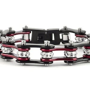 May include: Black and red chain link bracelet with clear rhinestones.