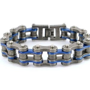 May include: A silver chain bracelet with blue accents. The bracelet is made of linked metal chains.