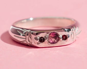 Pink tourmaline and red garnet band ring with two evil eyes