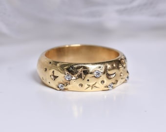 Wide band rings with clear crystals