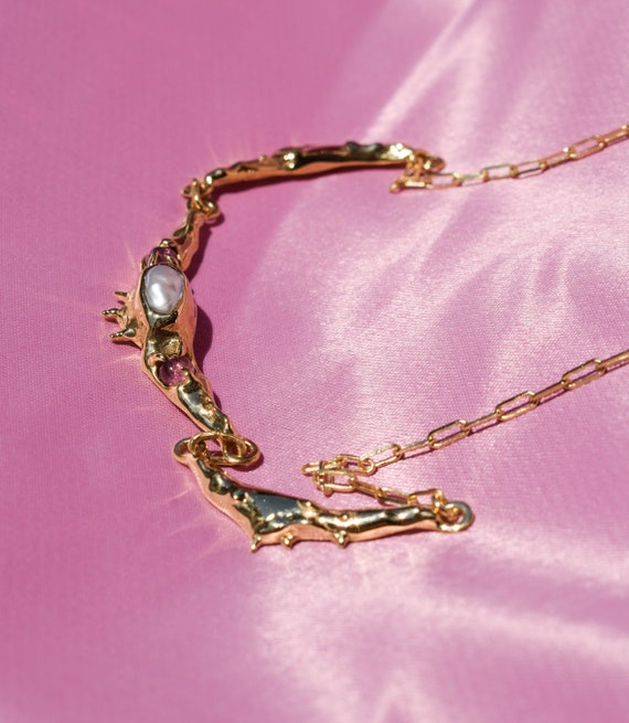 Statement necklace with irregular pearl and pink tourmalines in a raw, organic form