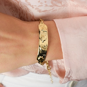 Moon and stars gold plated tag bracelet made from sterling silver