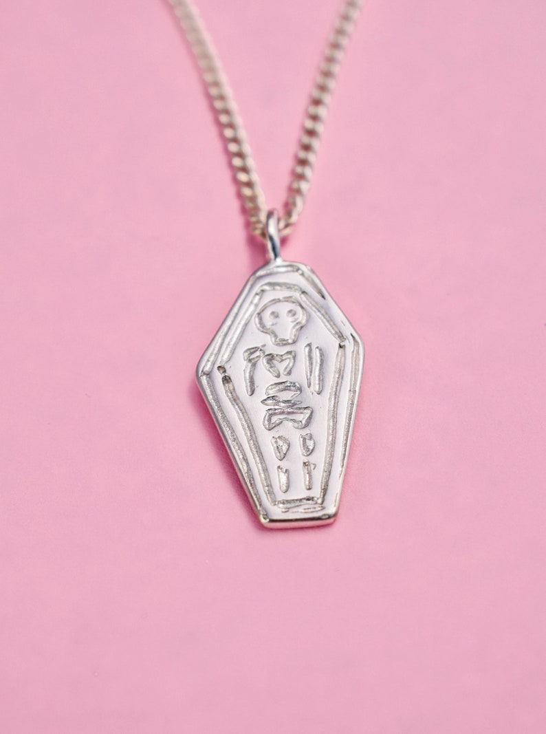 Skeleton in a coffin necklace