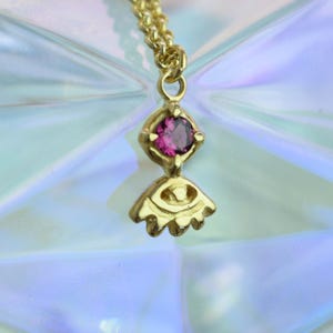 Pink tourmaline small necklace with an evil eye