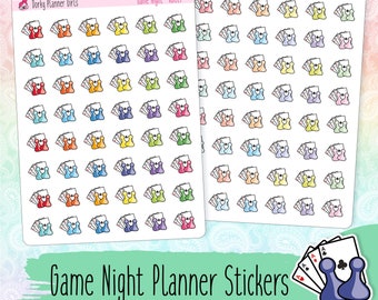 May include: A sheet of colourful game night planner stickers featuring a variety of game pieces, including dice, playing cards, and game tokens. The stickers are perfect for organising and planning game nights.