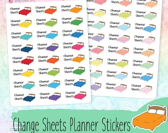 May include: A sheet of planner stickers featuring a bed with the text "Change Sheets" in various colors. The stickers are designed for use in a planner or journal.