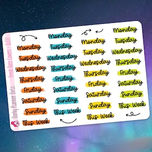 May include: A sheet of colourful planner stickers with days of the week and "This Week" written on them. The stickers are in various colours, including yellow, orange, blue, and green.