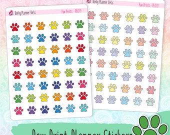 May include: Two sheets of colorful paw print planner stickers. The stickers are arranged in a grid pattern and feature a variety of colors, including red, orange, yellow, green, blue, purple, and pink. The text "Dorky Planner Girls" and "Paw Prints" is printed on the sheets.
